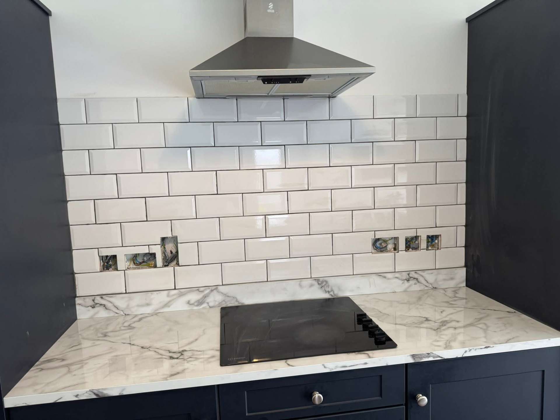 Crisp trim work where splashback meets units