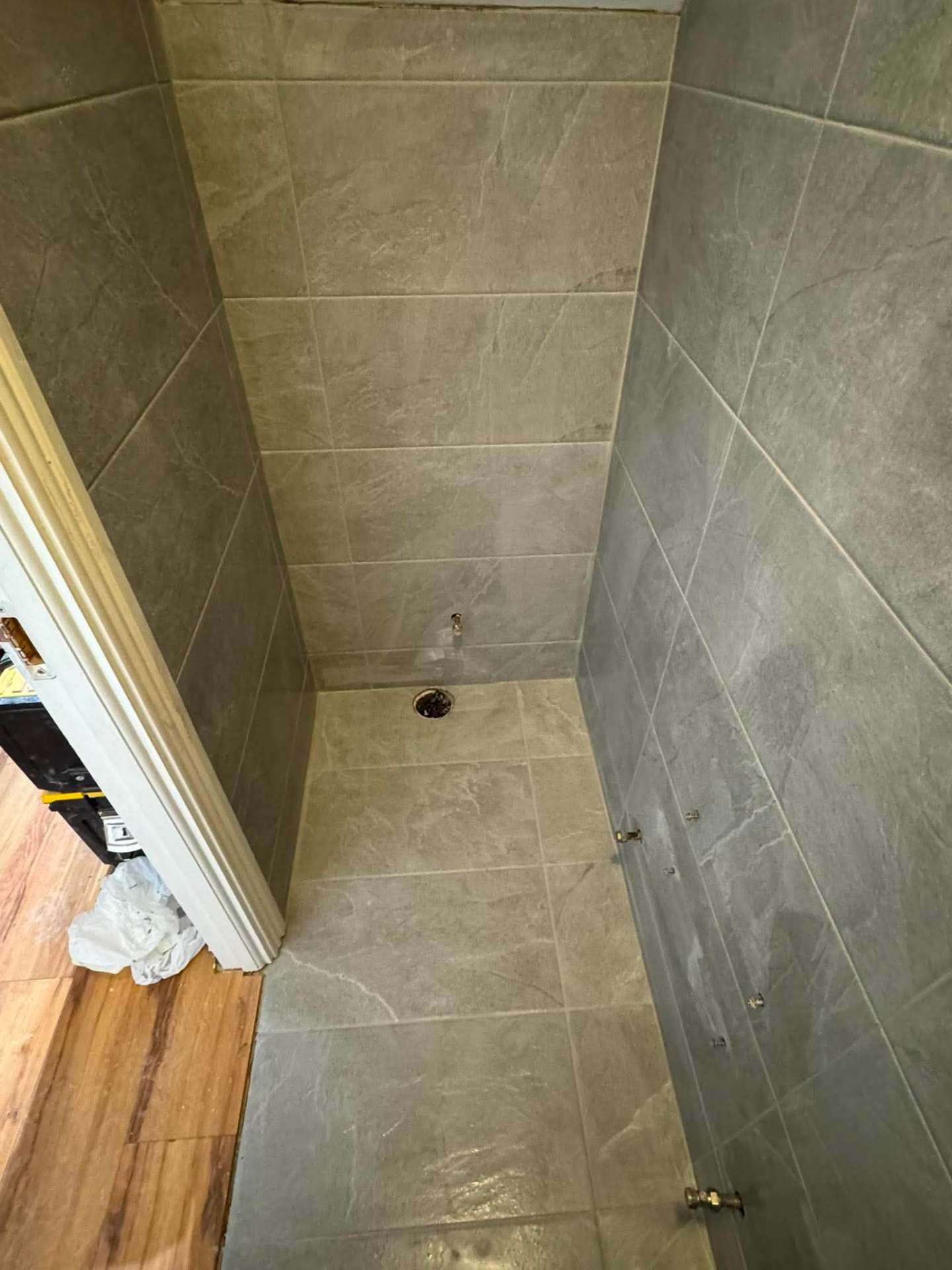 Stone-effect tile install in progress