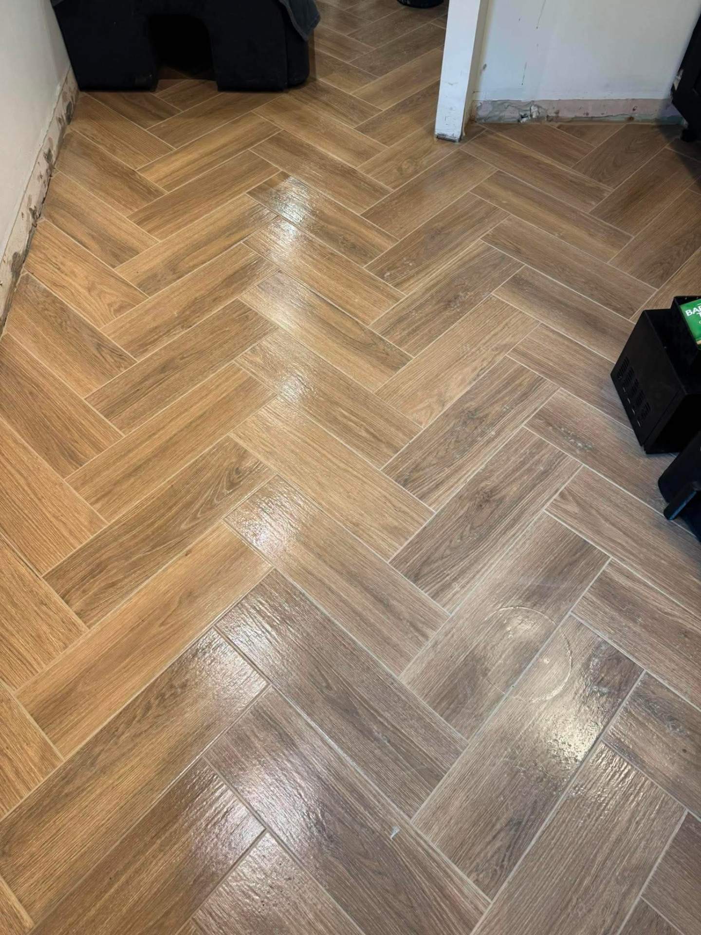 Finished herringbone floor through doorway