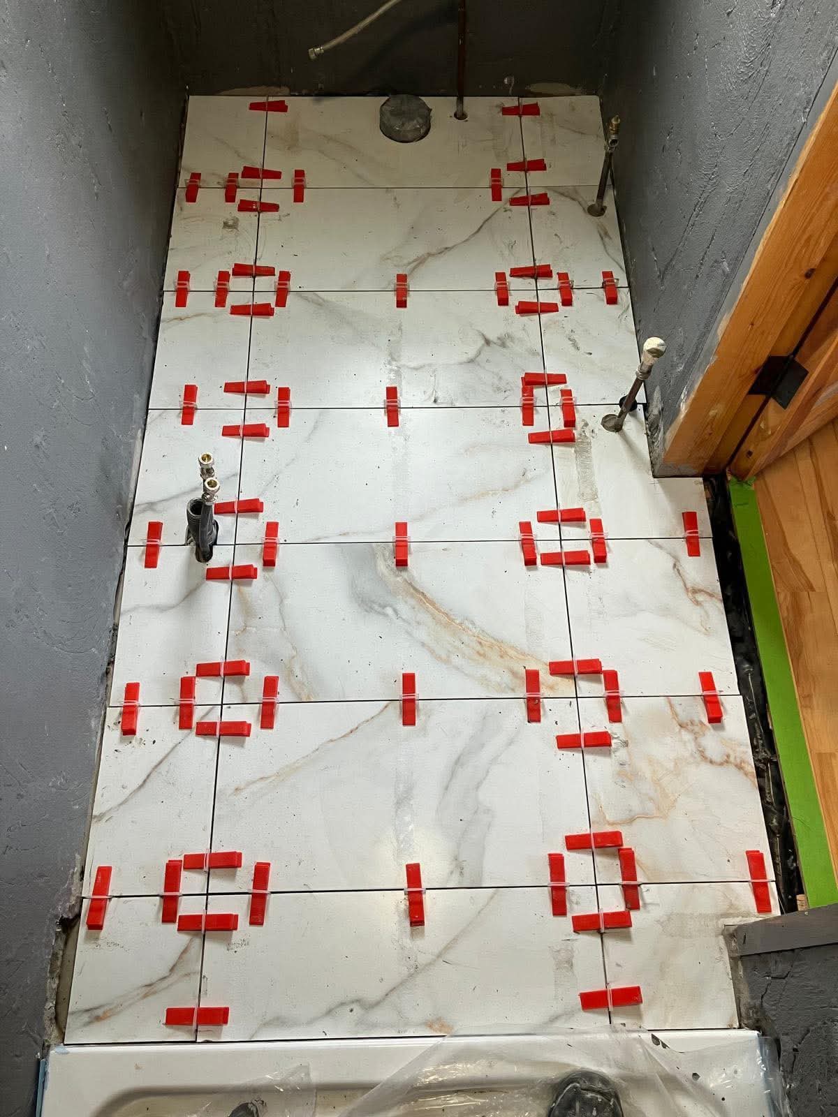 Floor primed with clips ready for tile