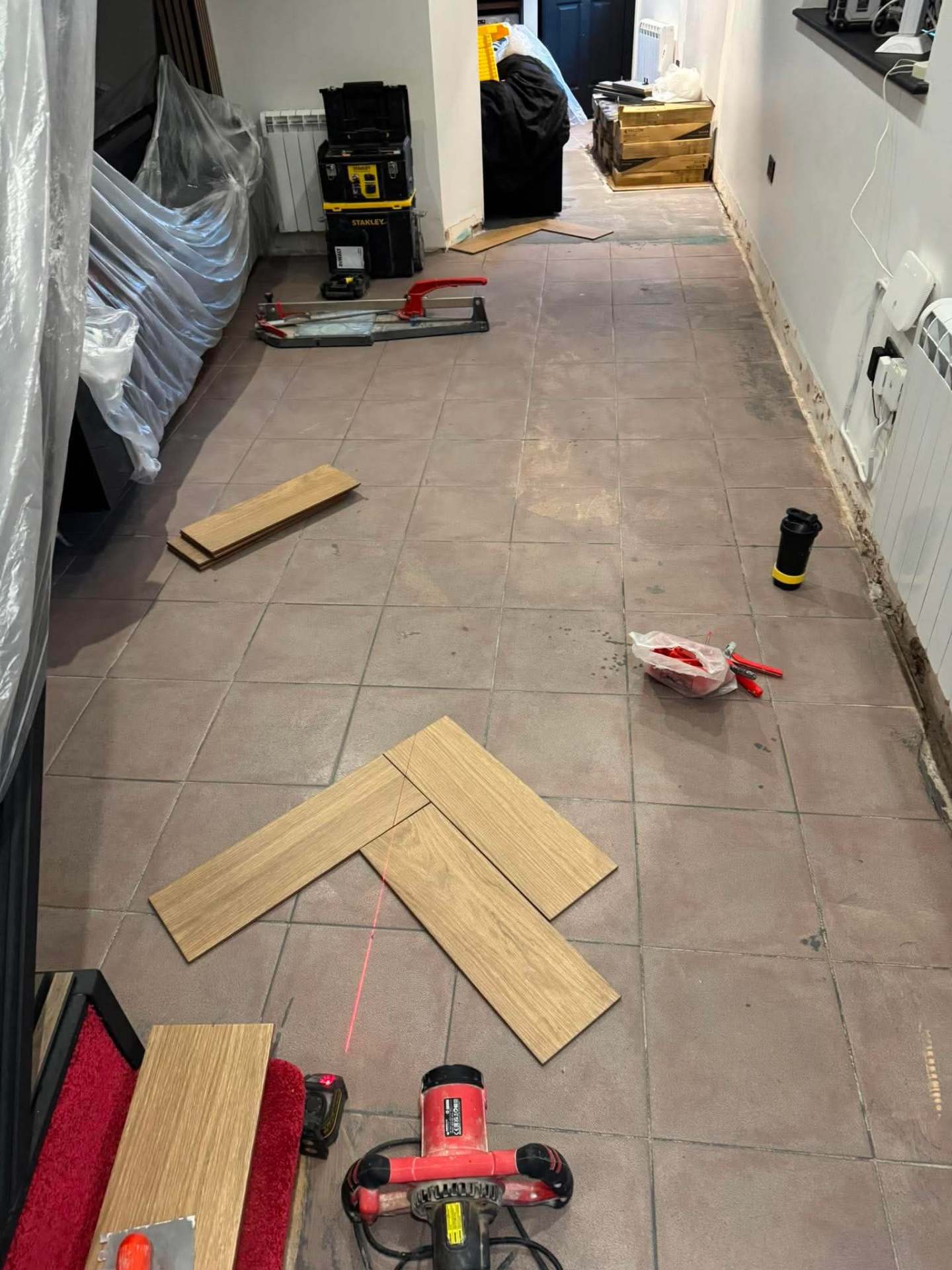 Patterned floor continuing under cabinetry