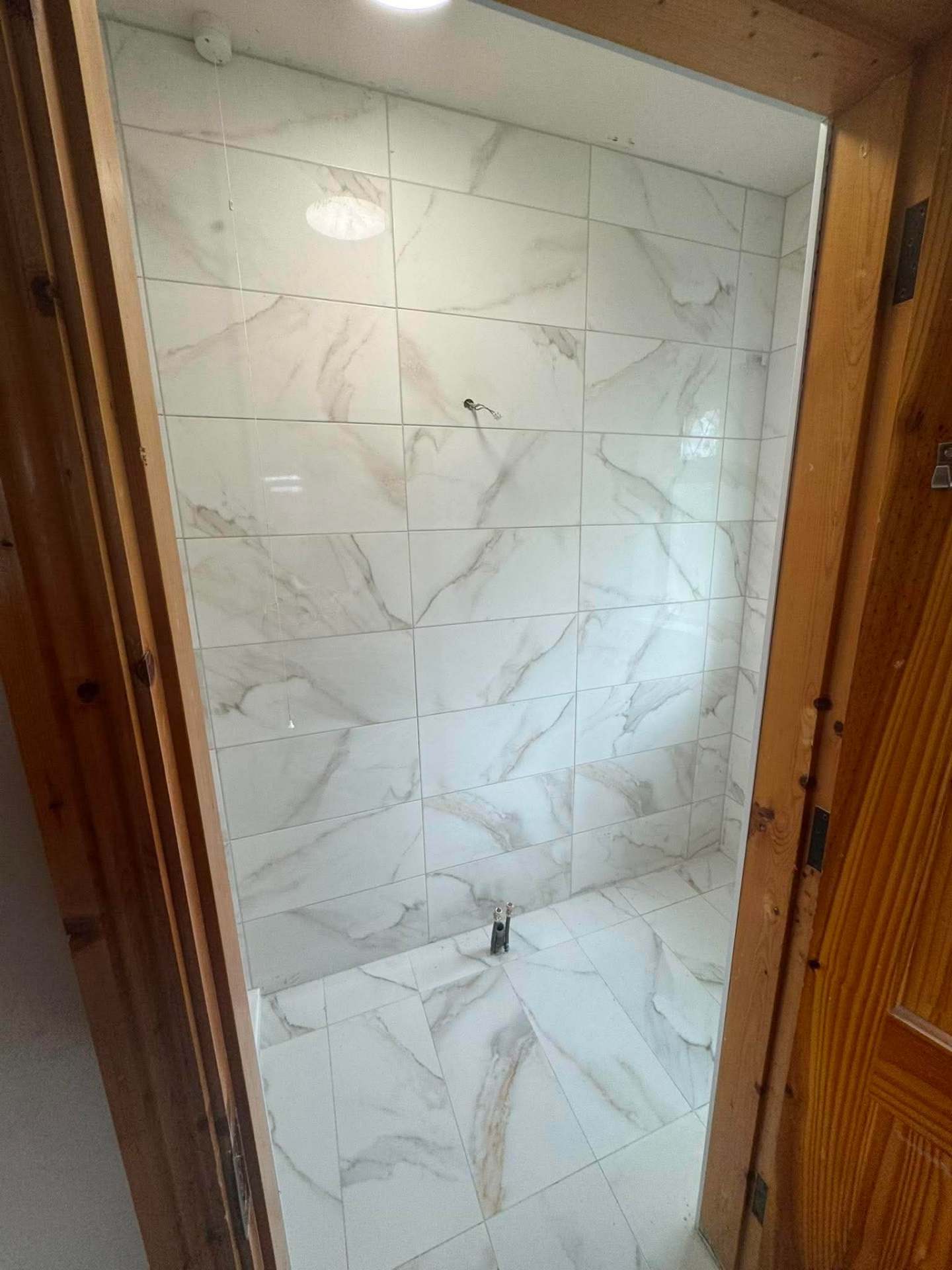 Dark veined marble feature wall, finished and grouted