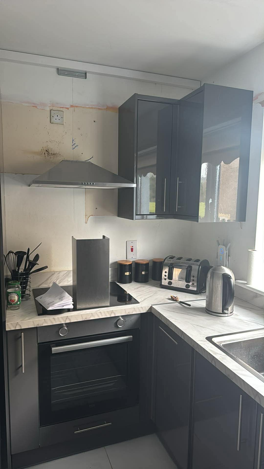 Navy shaker kitchen before splashback works