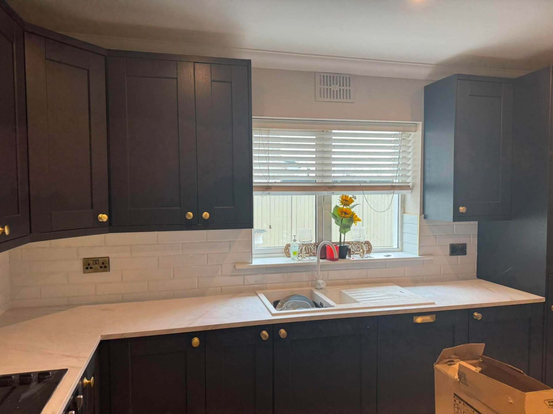 Splashback continues past sink and window