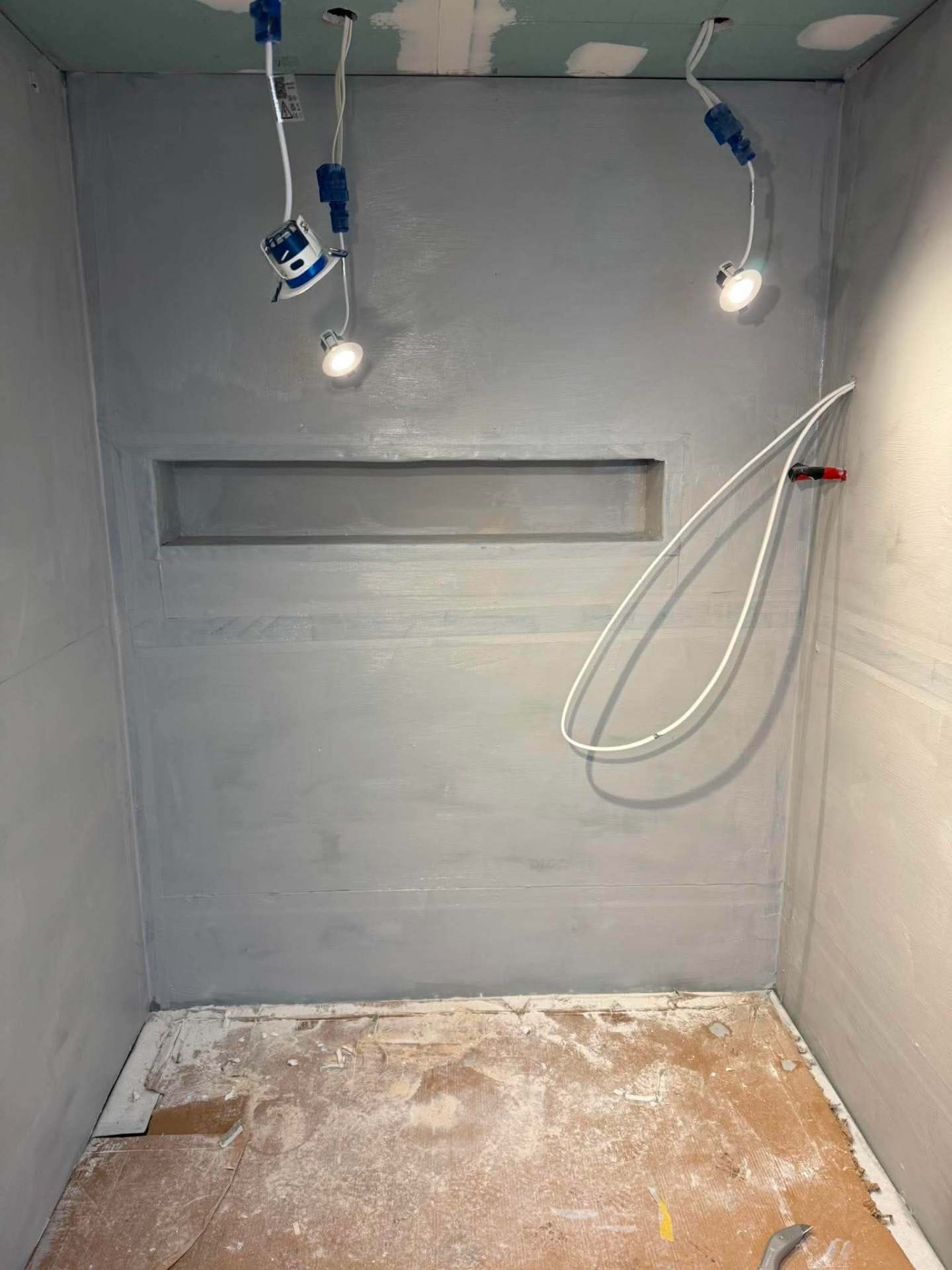 Finished Calacatta marble walk-in shower with niche