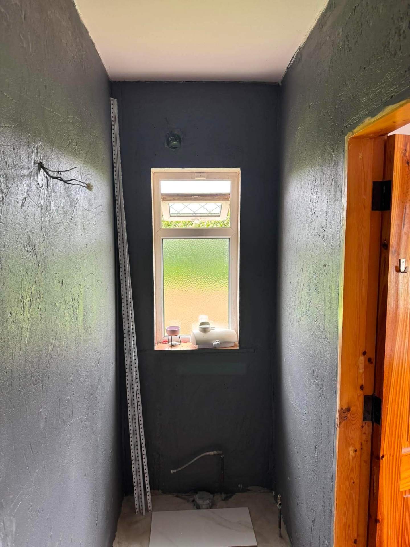 WC/bathroom corridor stripped back to substrate