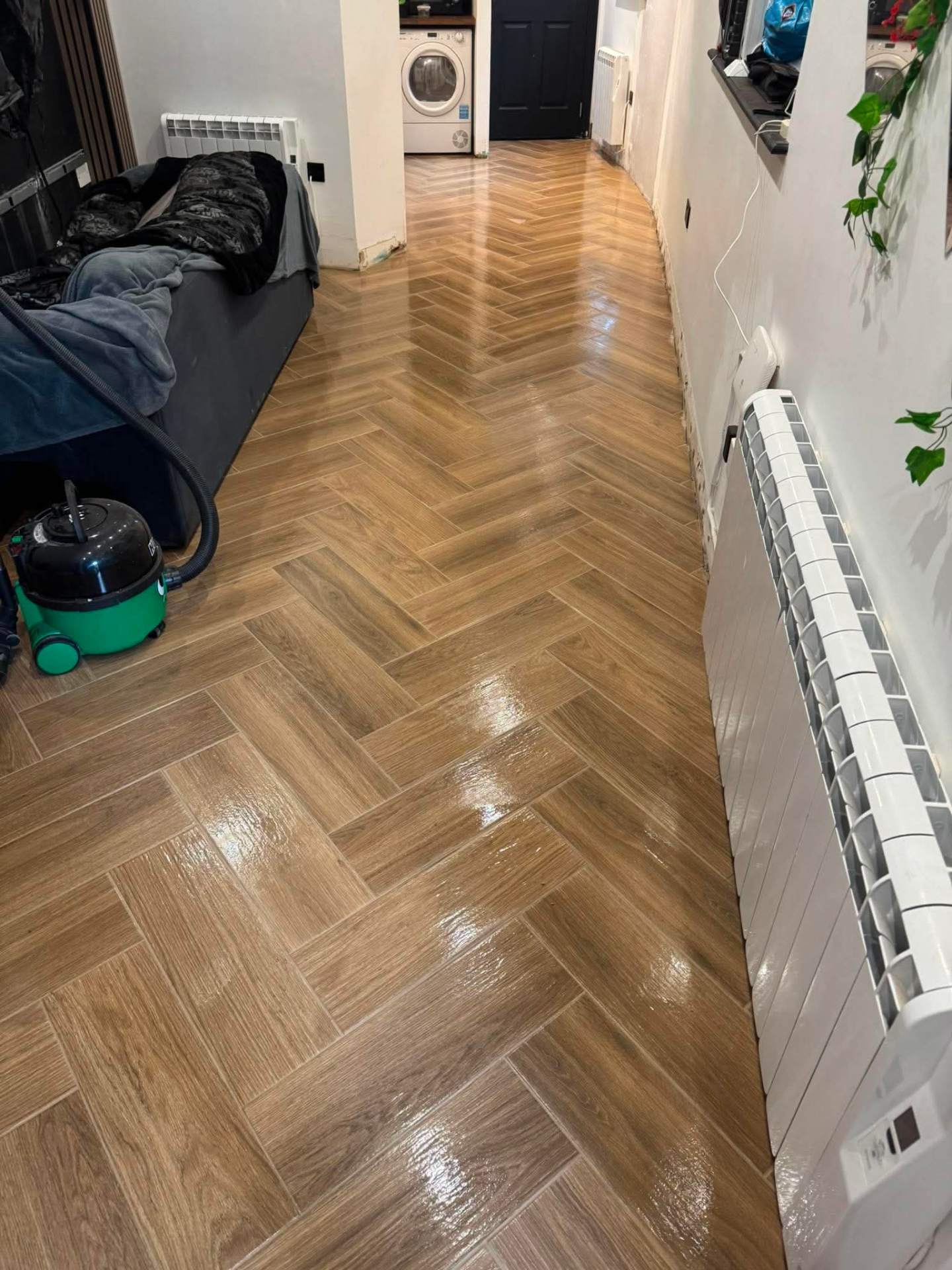 Herringbone install — hallway in progress